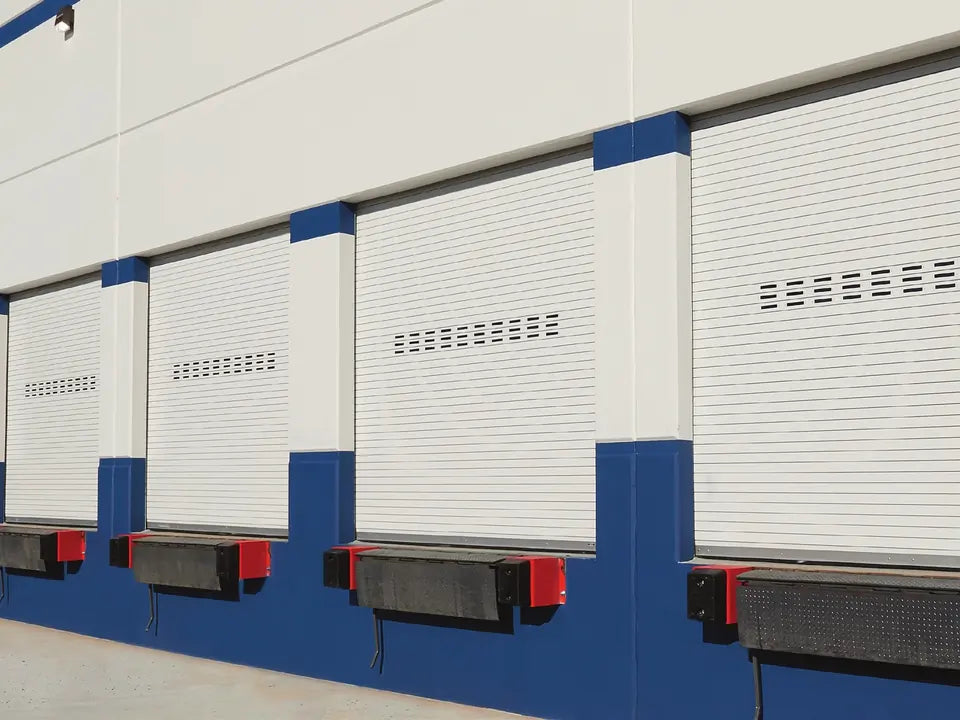 Row of ASTA 300 Series commercial slat doors on loading dock openings