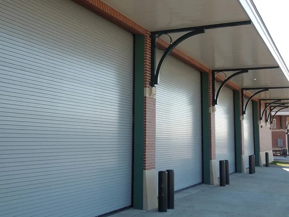 ASTA 600 Series insulated rolling service doors along a covered loading dock