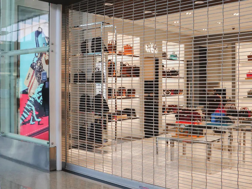 ASTA 800 Series rolling grille securing a retail storefront while the store stays visible